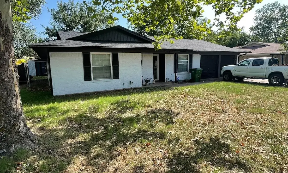 Professional roofing crew working on a residential roof in Milledgeville